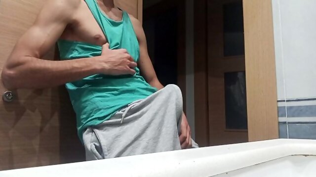 Slim Guy in a Tank Top Shows How He Cums with His Huge Shaved Cock