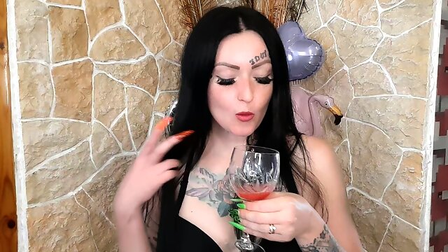 Dominatrix Nika spits chewed watermelon into a glass to give you a drink. Food fetish and spitting fetish.