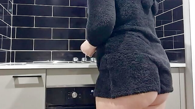 Housewife cleaning kitchen voyeur