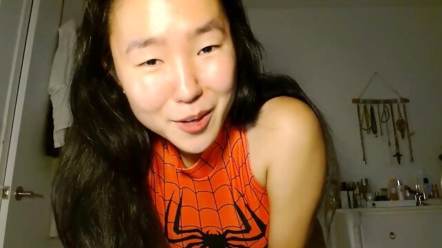 Shaved Asian milf squirting while masturbate on webcam