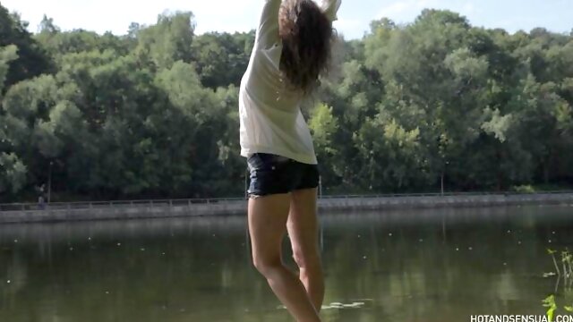 Sexy curly hair girl tight jean shorts tease and wet shirt boobs showing