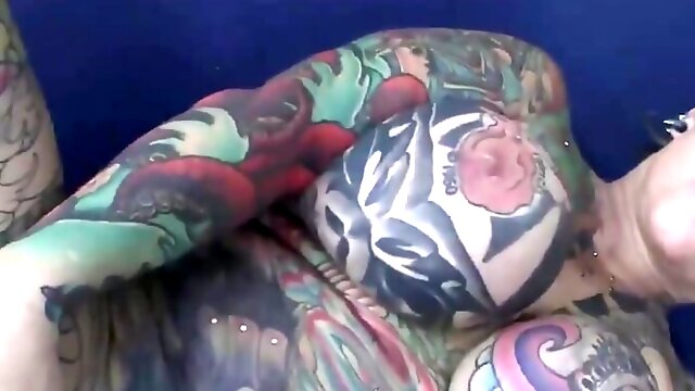 Full body tattooed milf gets fucked hard