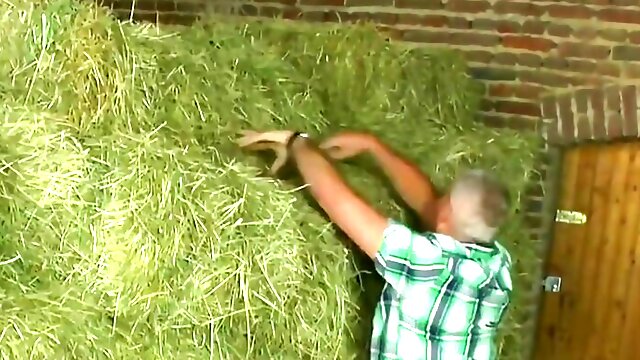 Older couple takes break from working at field