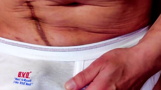 Squeeze your dick from the top of your white briefs and ejaculate as it is