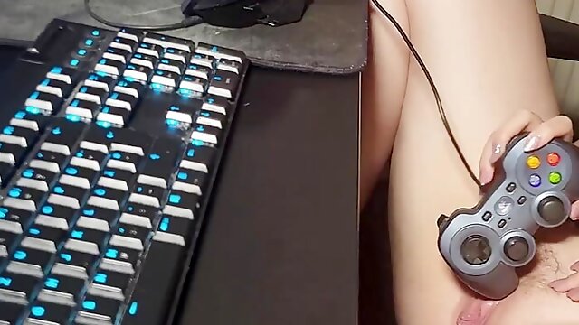 Masturbating on my own porn video with a gamepad.