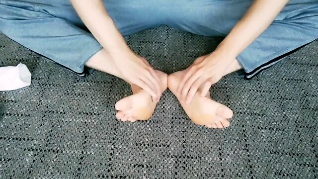 Cute guy stroking his legs and feet