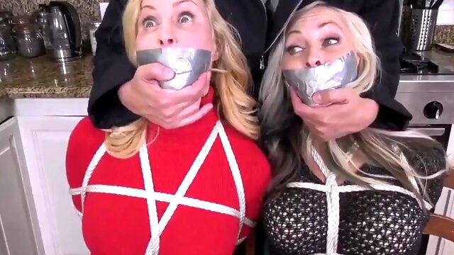 Two milfs in bondage and gagged with duct tape in their boots