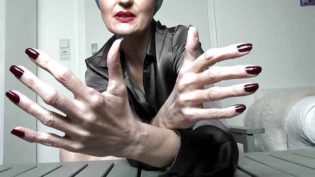 Long Dark Red Fingernails and Fist Hand