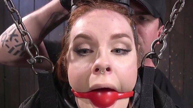 Whipped BDSM redhead with ballgagged mouth suffers orgasm