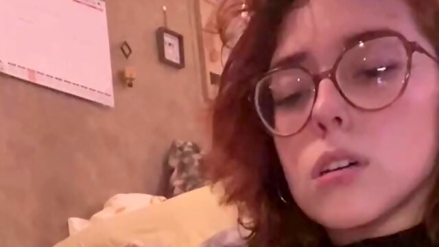 Dirty redhead curly bitch in glasses was penetrated in her shaved pussy by a fuck machine