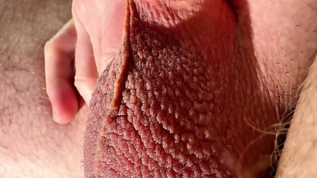 Close-up testicles massaging until big cumshot