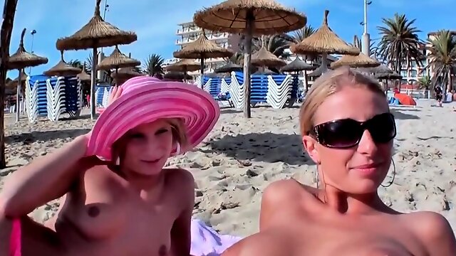 Two blonde sluts seduced into a threesome on the beach