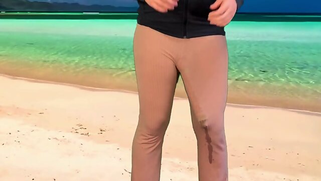 Monster fuck-stick tranny ejaculates in pants on public beach