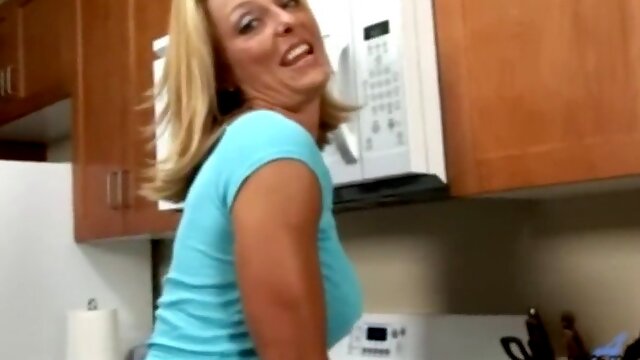 Busty Anilos Brenda James rides a dong on kitchen floor.
