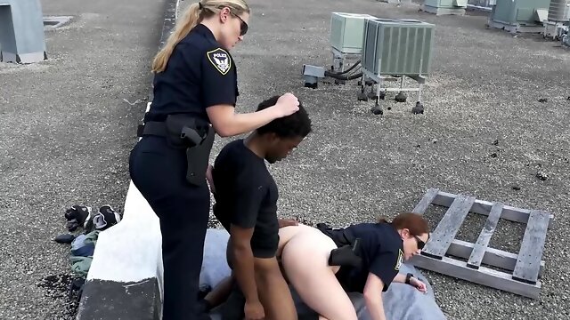 Two chubby female cops fucking with a black man on the roof