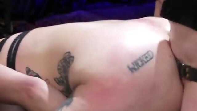 Mistress is torturing tied and gagged slavegirl in BDSM dungeon