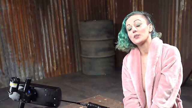 Kinky girl is plowed with a fucking machine while using a Hitachi