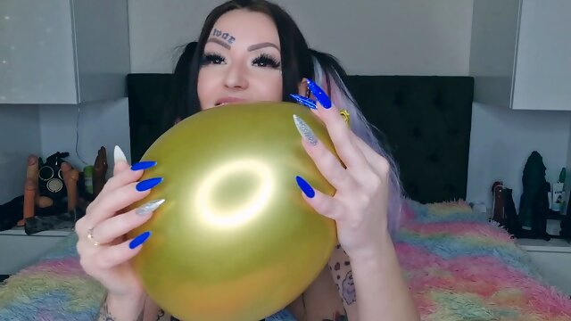 Domme Nika indulges in balloon fetish by inflating, scratching, and cumming on them