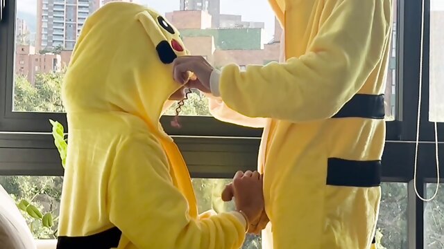 Pokemon-themed cosplay sex with Pikachu lookalike giving deepthroat blowjob and handjob