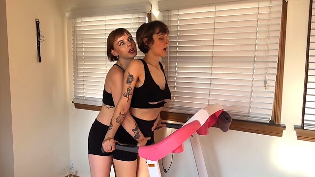 Dominant trainer edges submissive Ayala Fae in spandex shorts