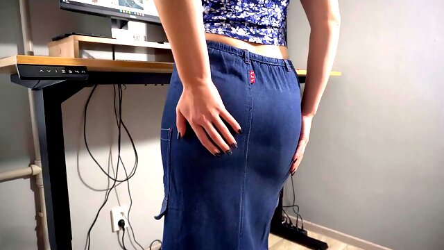 MILF office worker in a long skirt teasing as a secretary