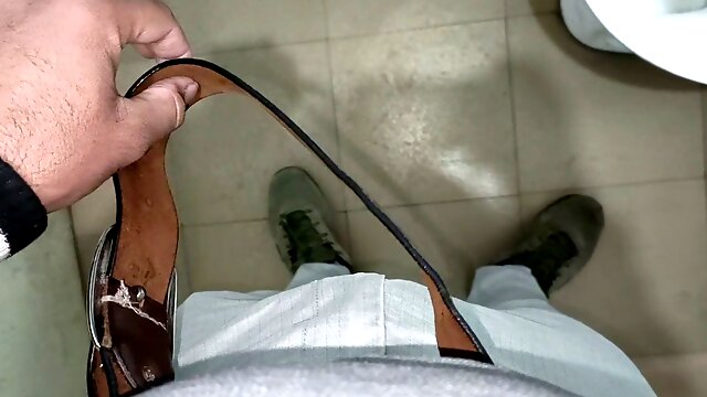 Stockings-clad hottie enjoys public restroom handjob in close-up action