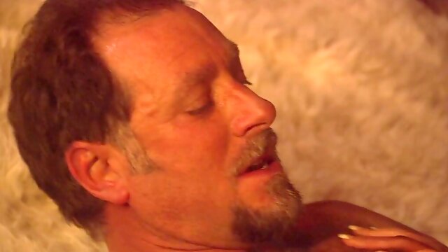 Busty milf gets her pussy pounded by the fireplace