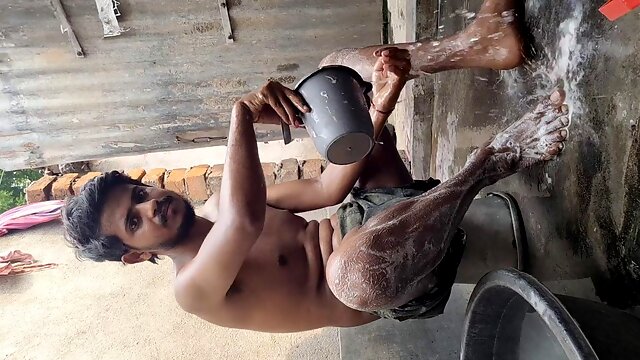 Gay man enjoys hardcore anal with a hung stud while giving a handjob