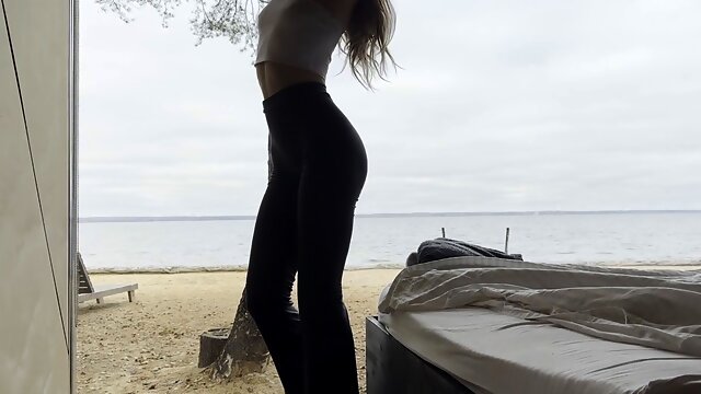 Gorgeous deity practices riverside yoga stretching