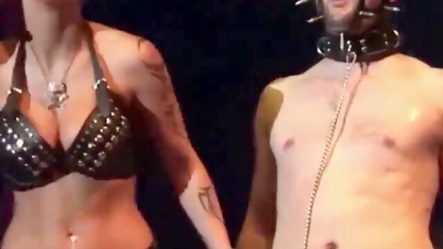 Wild syringe fetish show on public stage featuring extreme unwrapping