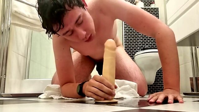 Guy gags on a dildo right after showering
