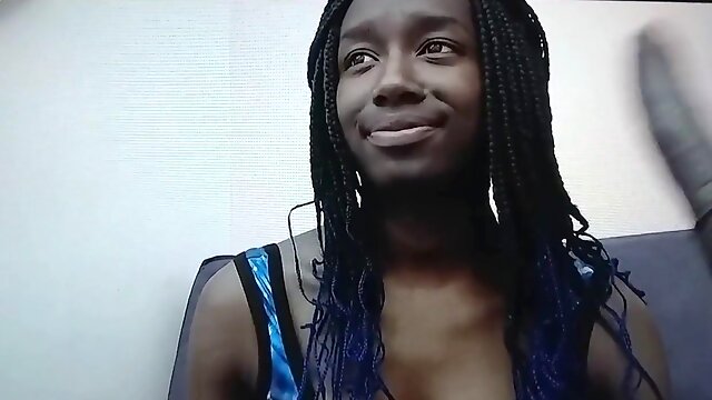 Stunning ebony babe seductively plays with dildo on cam