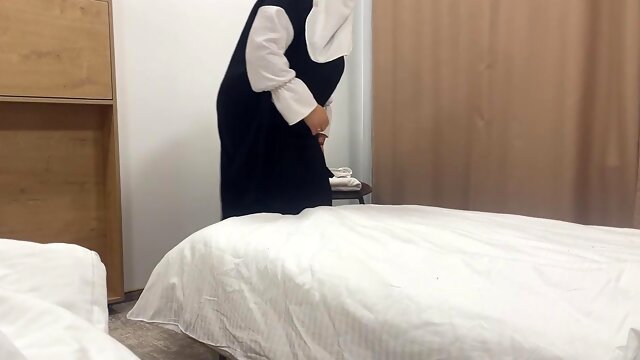 Seductive Arab maid in hijab seduces a hotel guest in his room