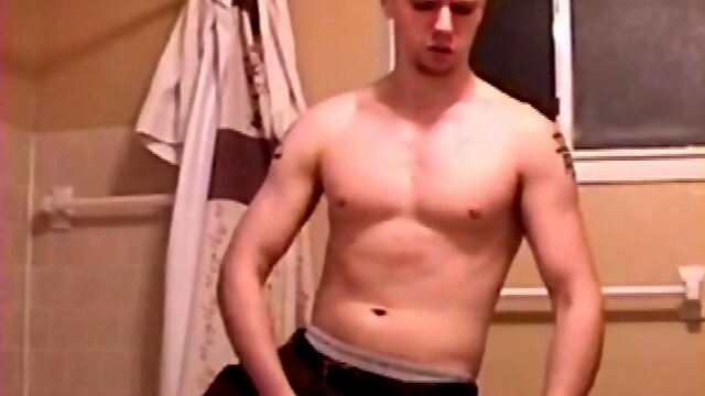 After a busy day Shawn is in the bathroom getting ready to shower and decides to play with himself through his pants. He strips and flexes for the camera, while stroking his hard cock, and soon Shawn blasts a warm cum load onto his chest.