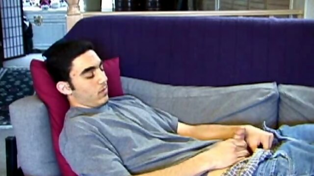 After a close-up of jeans being unzipped, Karod kicks back on the sofa and rubs a growing bulge through his boxers. If his complexion is less than perfect, his lean torso, hairy legs and thick happy trail more than compensate.