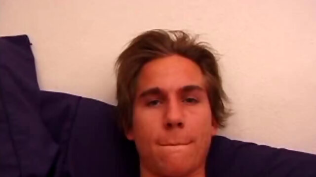 Sprawled out on the bed, Brock Labelli pulls out his cock and starts stroking. After the cameraman douses him with baby oil he continues to play with Brocks dick.