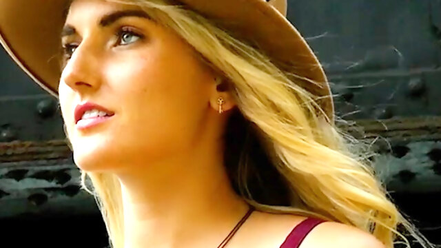 Sweet blond musician posing outdoor