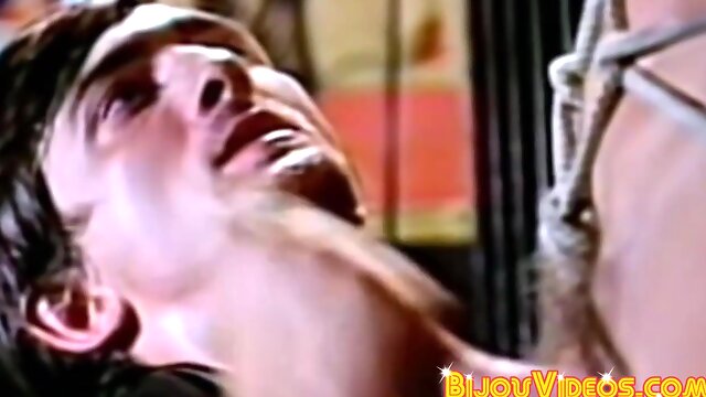 Submissive stud receives blowjob in retro threesome