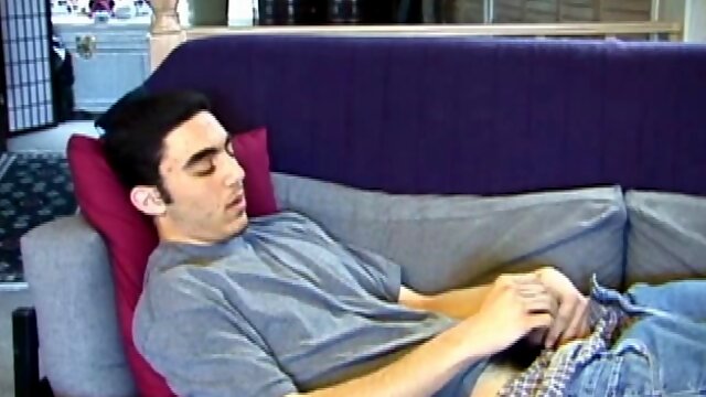 After a close-up of jeans being unzipped, Karod kicks back on the sofa and rubs a growing bulge through his boxers. If his complexion is less than perfect, his lean torso, hairy legs and thick happy trail more than compensate.