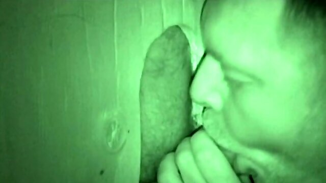 Mitch is at the glory hole and we watch as Auntie Bob pulls his dick out of his pants and goes down on it. The mature man lics and sucks Mitchs cock until theres no holding back.