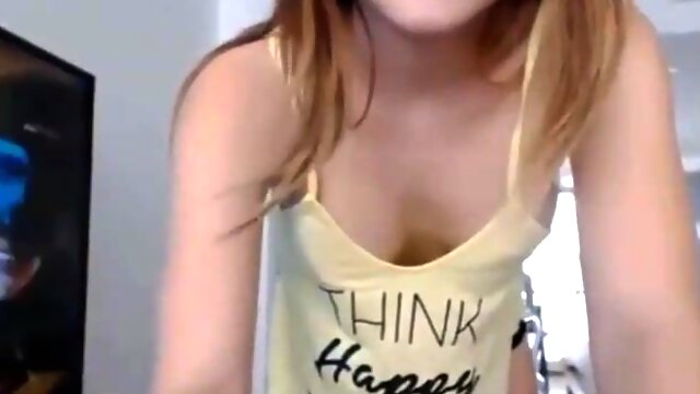 Superb looking teenager is posing and taunting in front of the camera in underpants and flog top