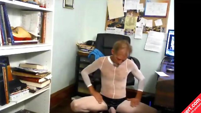 ROBERT RICHARD  MILGATE IS A SLUT WEARING A SHEER WHITE BODYSTOCKING AND HIGH HEELS