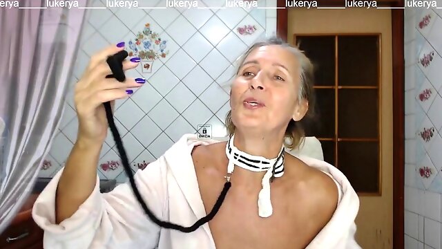 Super-fucking-hot hostess Lukerya in the kitchen in a dressing gown.
