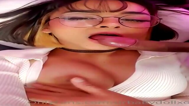 Honey with glasses is doing wild stuff in front of the camera, late at night