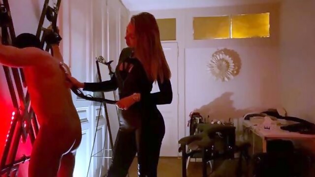 Merciless MILF mistress spanking her slave into submission