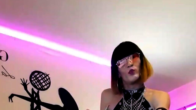 A French Shemale Bombshell Does a Live Striptease