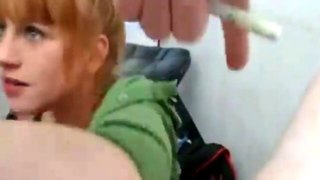 Redhead milf deepthroats  behind counter of Shop