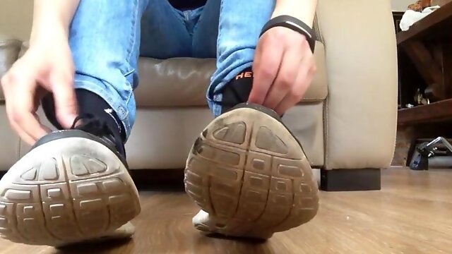 Taking off black dirty socks, sock fuzz and dirty feet