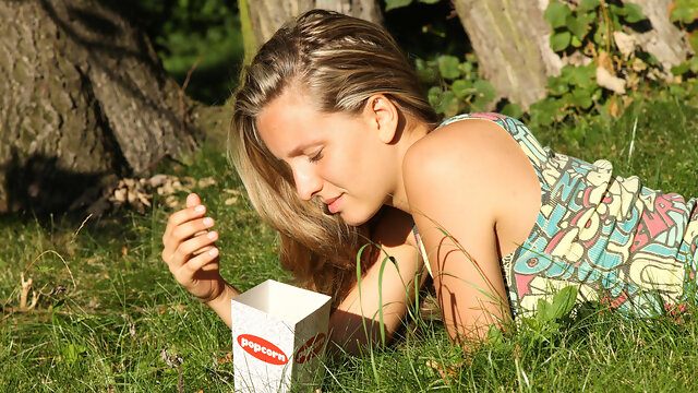 Cute blonde with natural breasts gets wet in the field