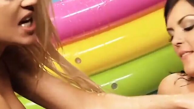 Cindy Behr and Jasmine Black smoke each others toes in a pool of jelly